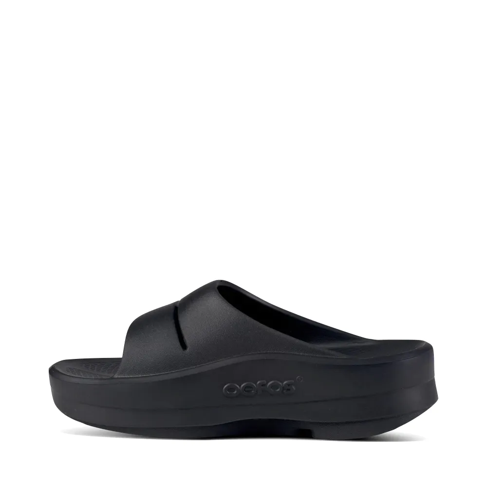 OOfos OOmega OOahh Slide Sandal in Black